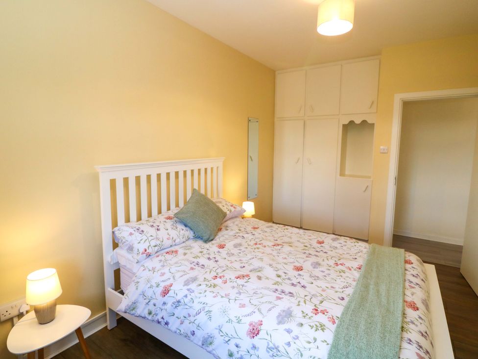 A bedroom with a bed and wardrobe at Thadg and Hannah’s in Miltown