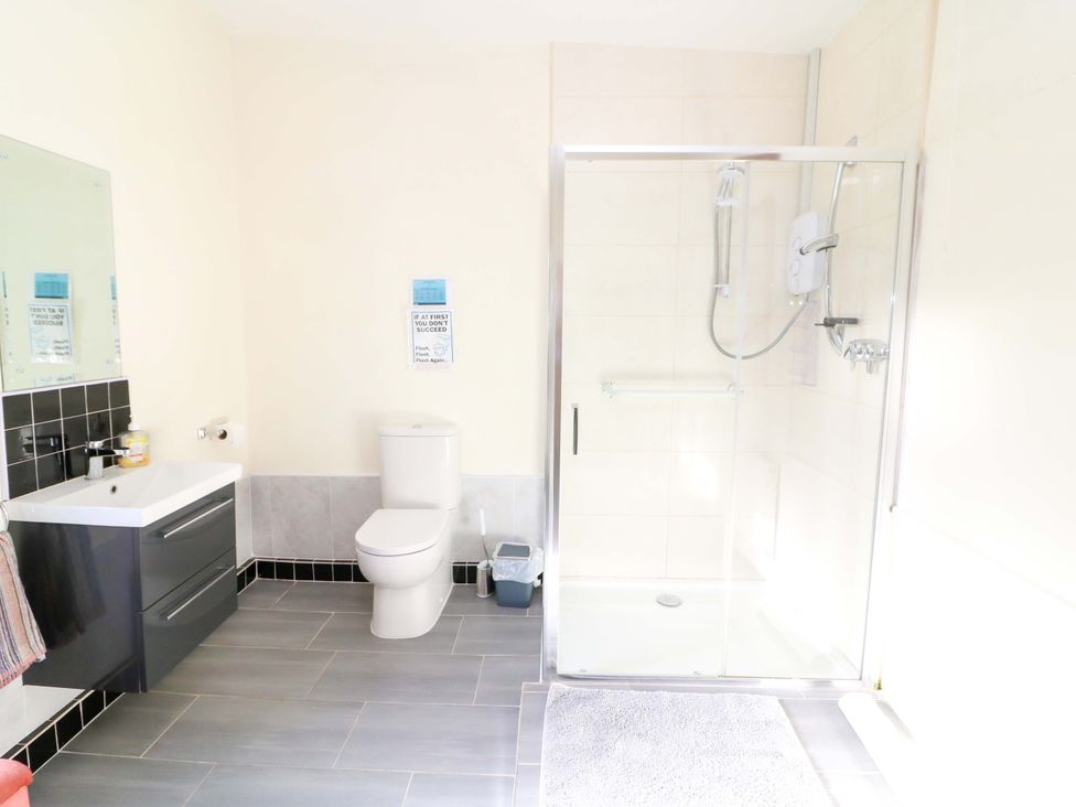 A bathroom with a shower and sink at Thadg and Hannah’s in Miltown