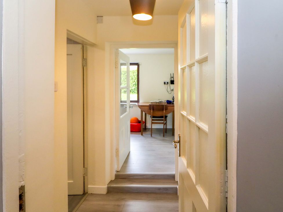 A hallway with doors leading to the kitchen at Thadg and Hannah’s in Miltown