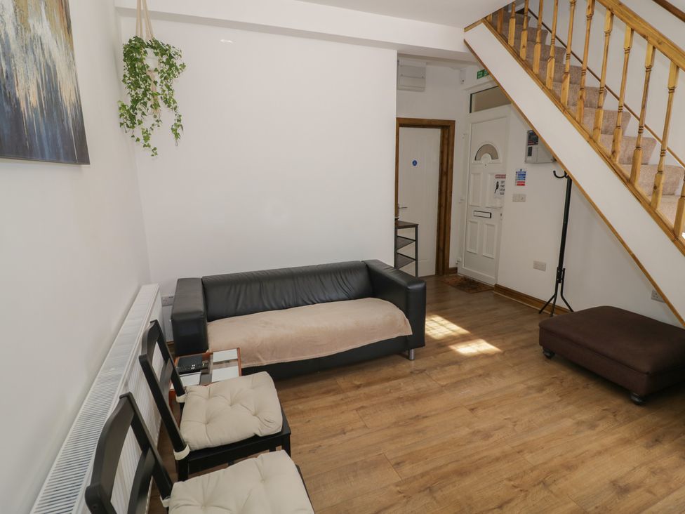 A living room with a sofa and chairs at JMG House West Bromwich