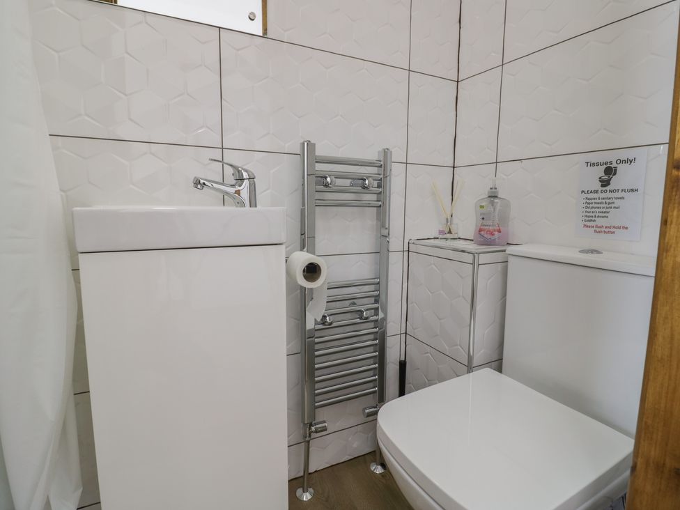 A bathroom with a sink and toilet at JMG House in West Bromwich