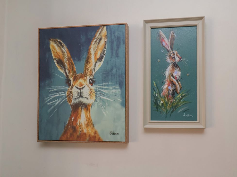 Paintings of rabbits on a wall at 44 Love Lane, Whitby