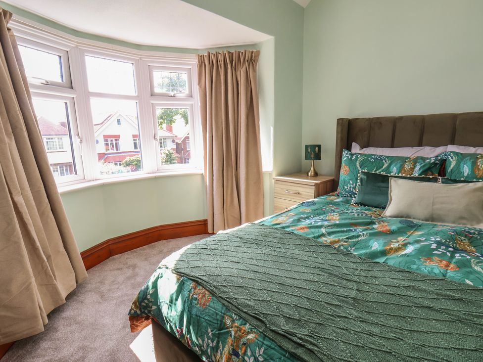 A bedroom with a bed and bedside table at 44 Love Lane in Whitby