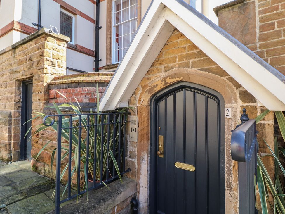 An entrance with a door and plants at Tower Cottage in Nottingham