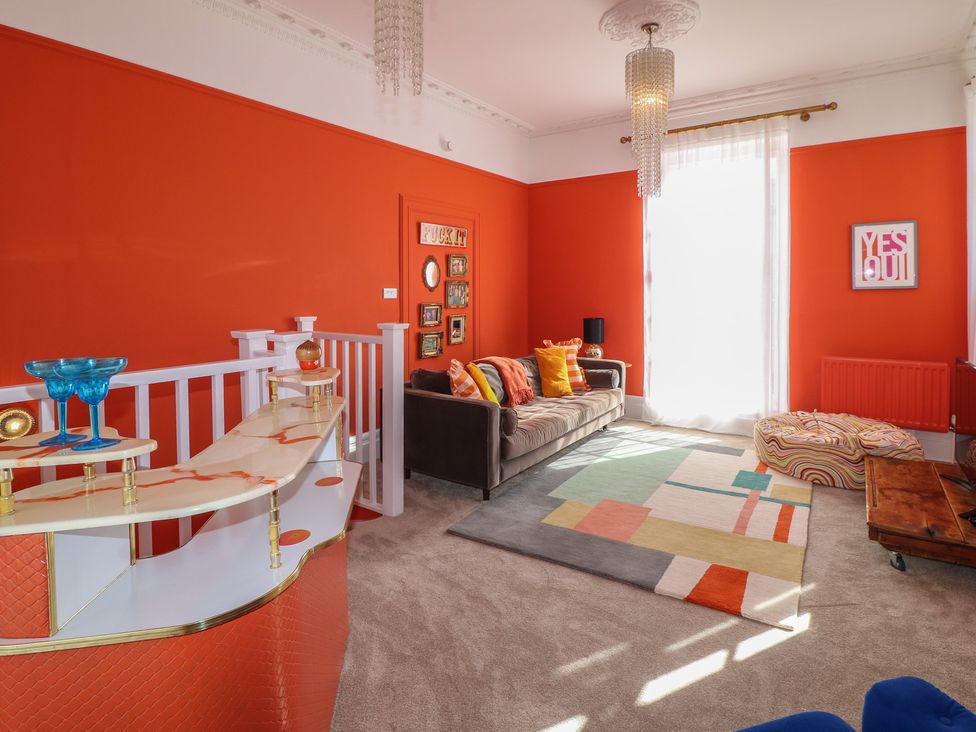 A living room with a sofa and a coffee table at Tower Cottage in Nottingham
