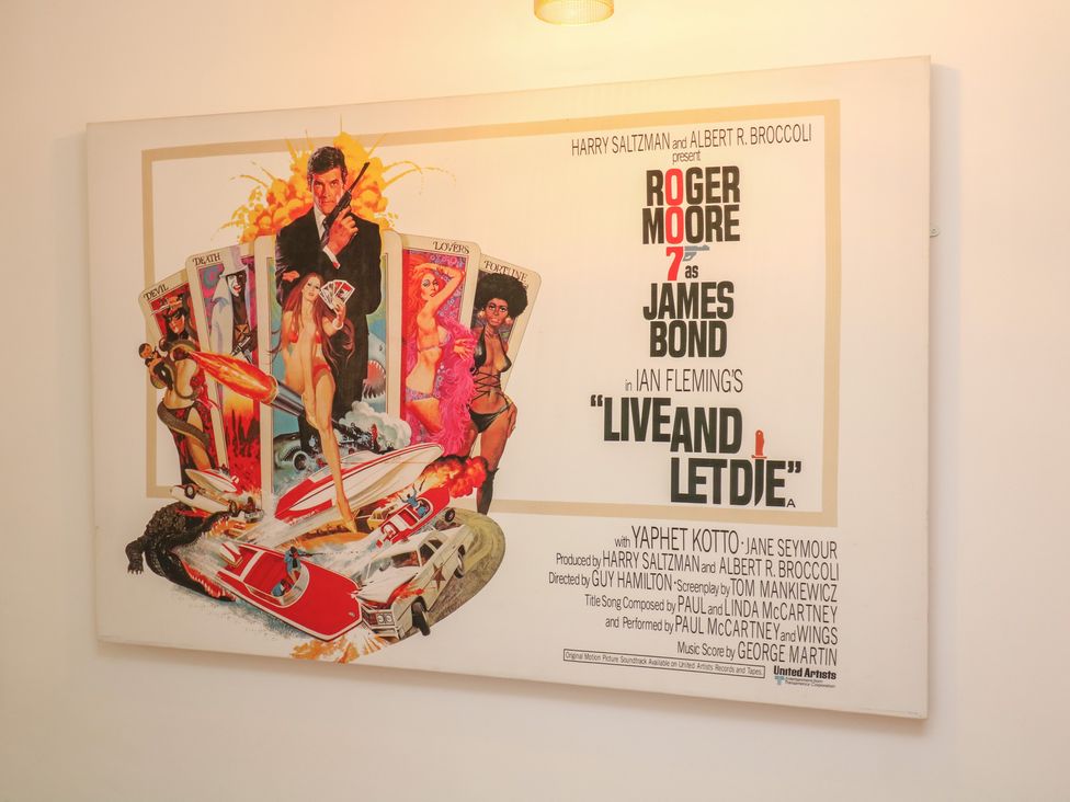 A poster of the film 'Live and Let Die' featuring Roger Moore at Tower Cottage Nottingham