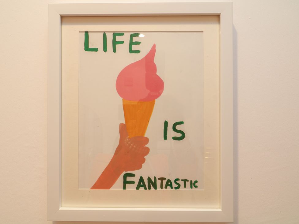A framed artwork with the text 'LIFE IS FANTASTIC' and an ice cream cone illustration at Tower Cottage Nottingham