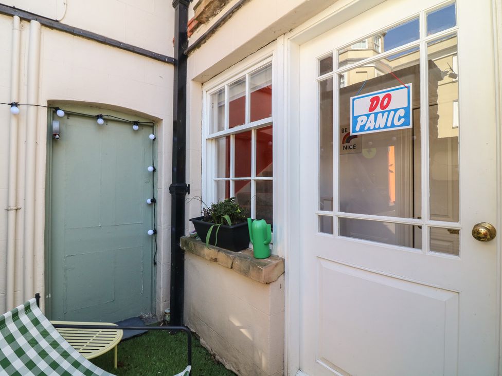 An outdoor area with a door and a sign at Tower Cottage in Nottingham