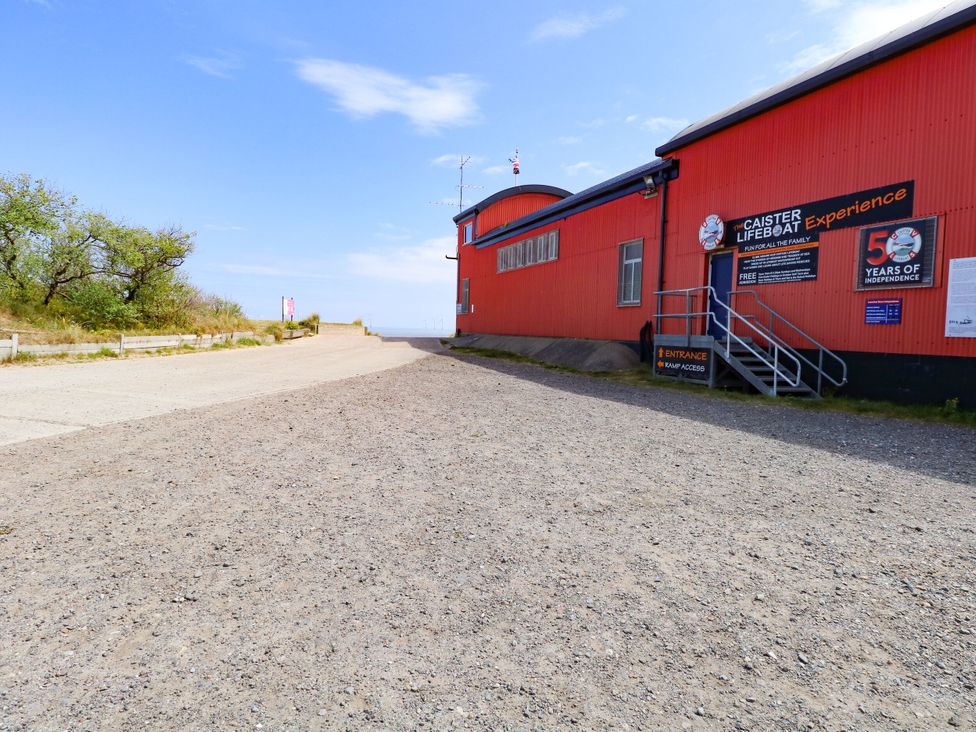An entrance to Caister Lifeboat Experience with a path at Mabby Great Yarmouth
