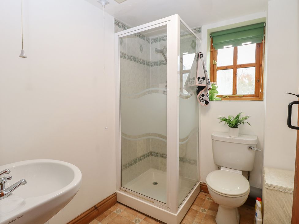 A bathroom with a shower and toilet at Mabby in Caister-On-Sea