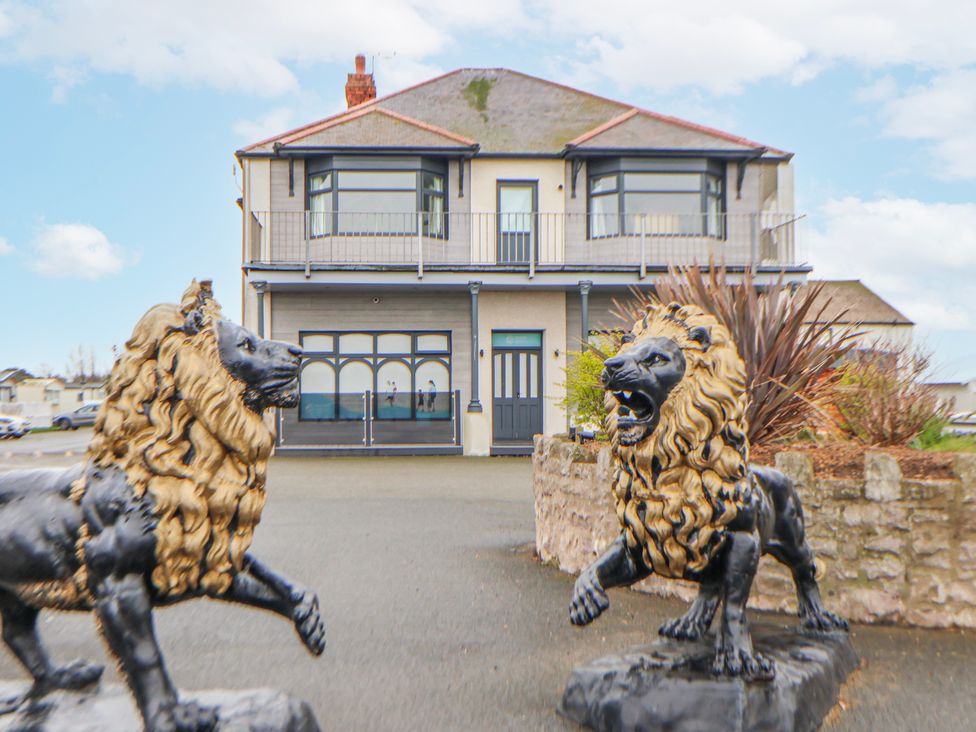 A house with lion statues at Chappie's Caravan 2.0 Rhyl