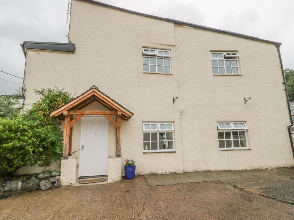 An exterior view of a house with a porch at No 8- Farmhouse Retreat in Keswick