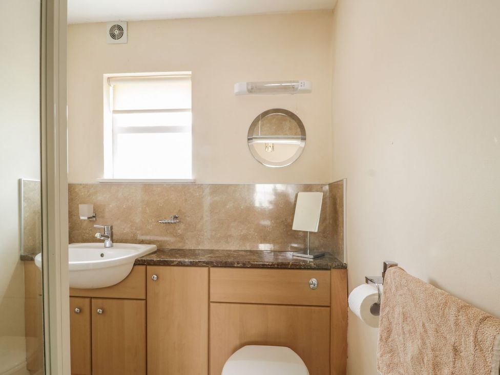 A bathroom with a sink and toilet at No 8- Farmhouse Retreat in Keswick