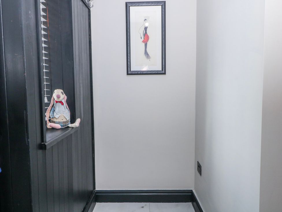 A hallway with a toy on a window ledge at 2 Manor House farm in Higher Ogden near Newhey