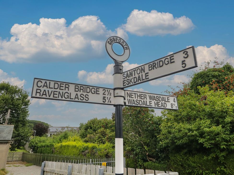 A directional sign with distances to various locations at Yewbarrow Seascale