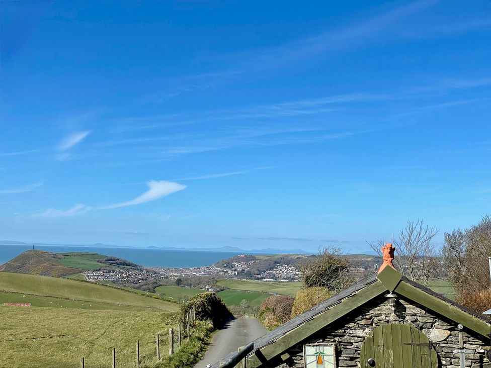 A view of hills and ocean from a road near Penpegws near Aberystwyth
