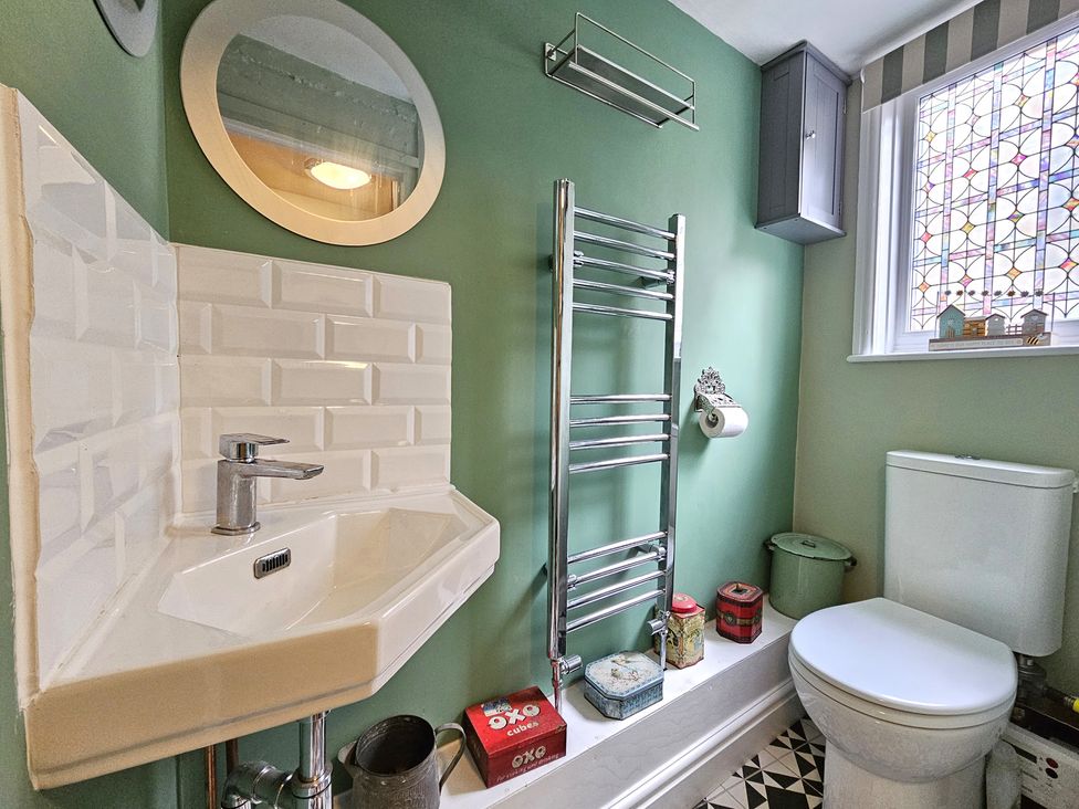 A bathroom with sink and toilet at Katie's Cottage in Church Stretton