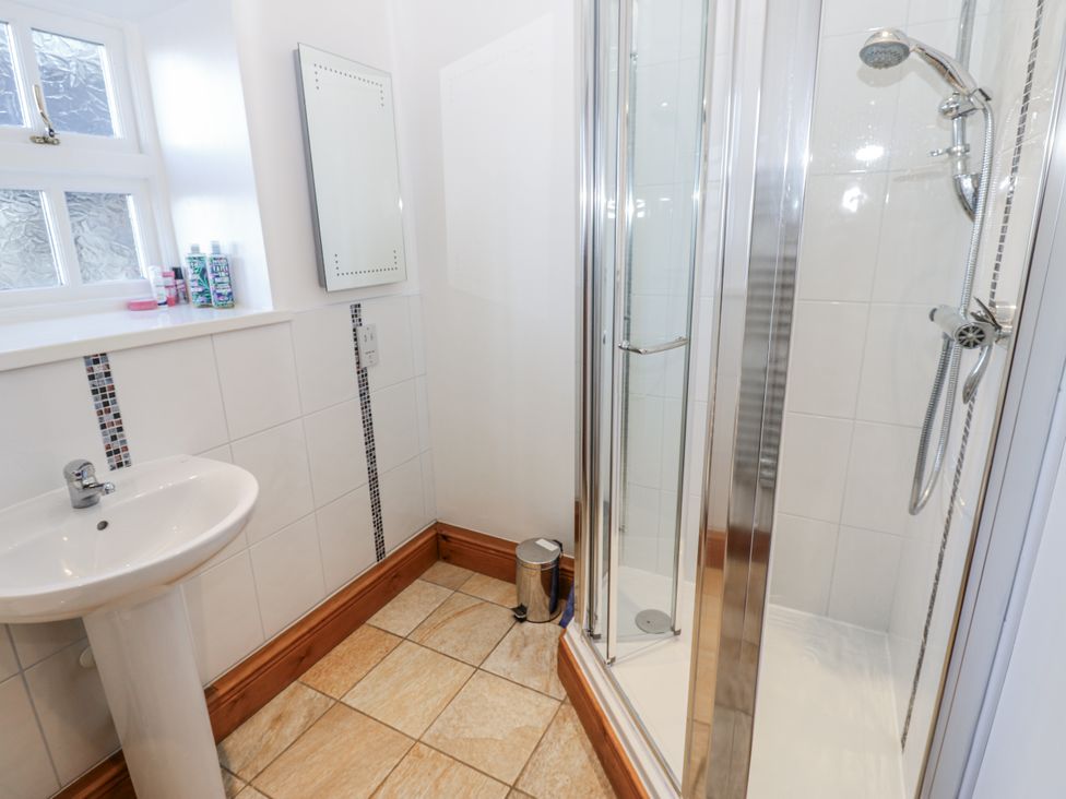 A bathroom with a sink and shower at Swallows Rest in Hexham