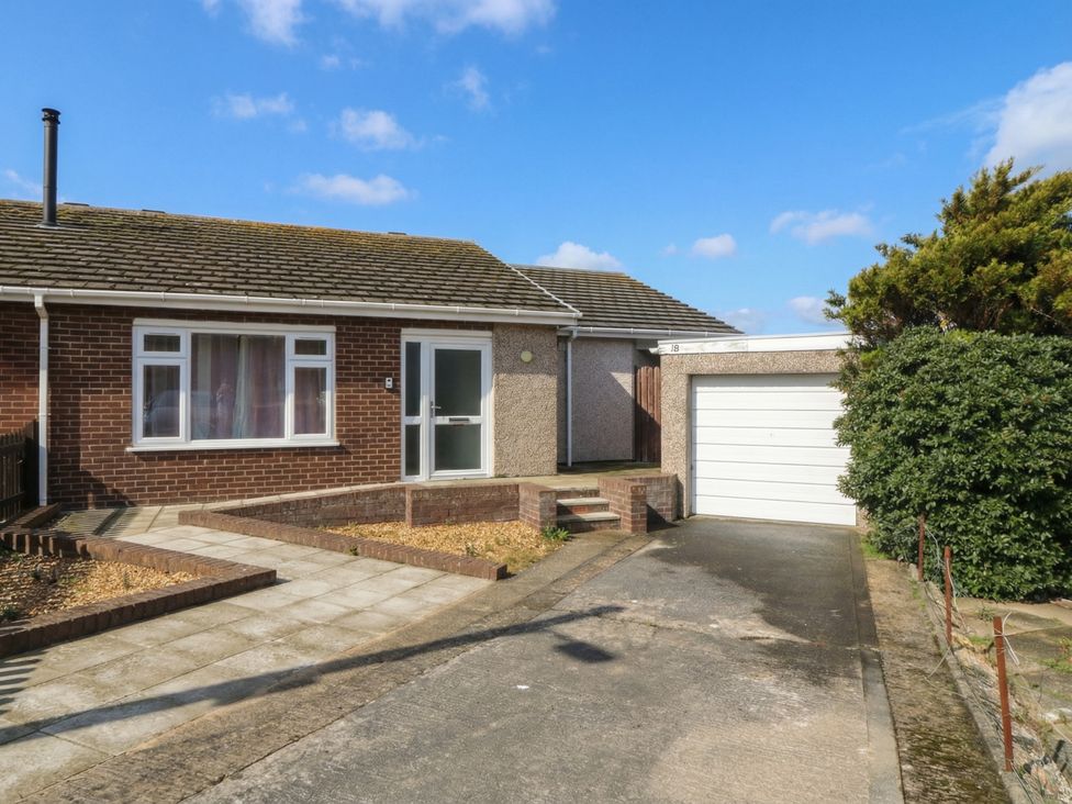 A house with a driveway and garage at Orme View Penmaenmawr