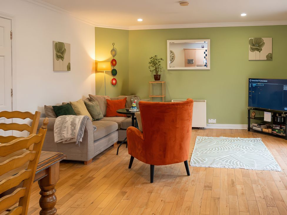 A living room with a sofa and television at Enniskillen hideaway Enniskillen