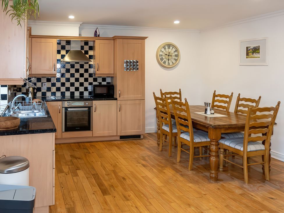 A kitchen with dining table and chairs at Enniskillen hideaway Enniskillen