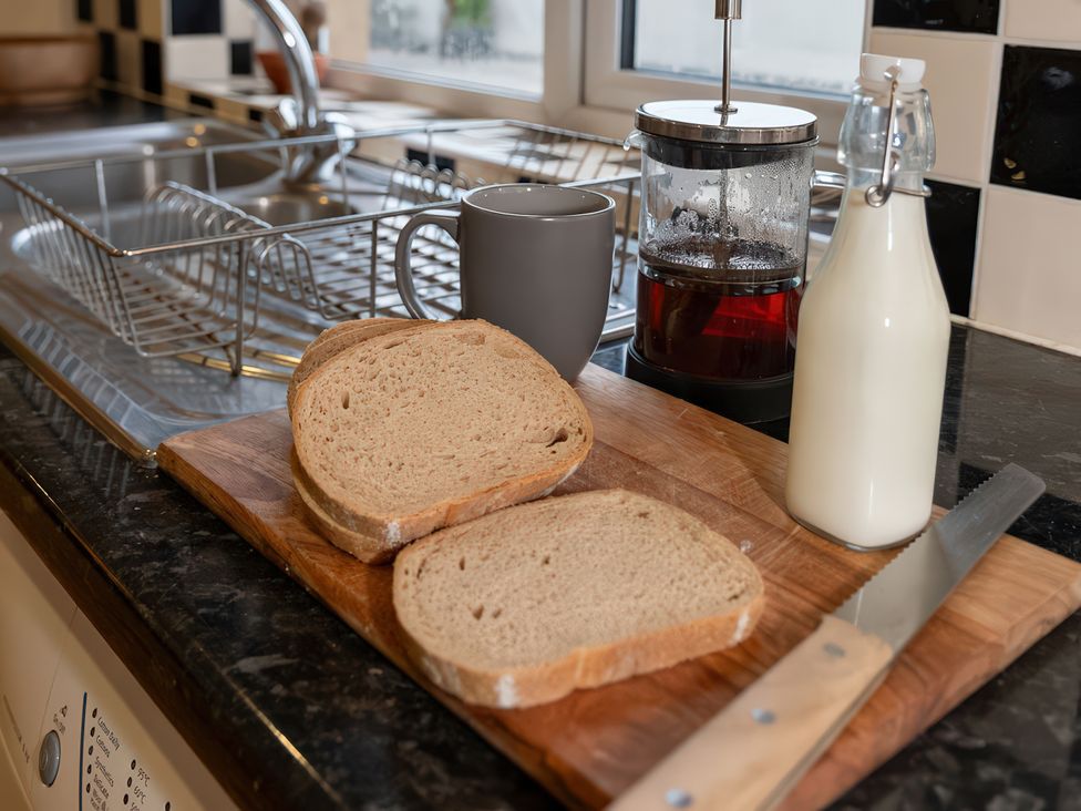 A kitchen with sliced bread and a coffee mug at Enniskillen hideaway Enniskillen