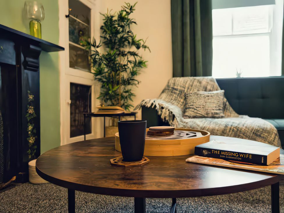 A living room with a coffee table and sofa at 20 Bridge Street Morpeth