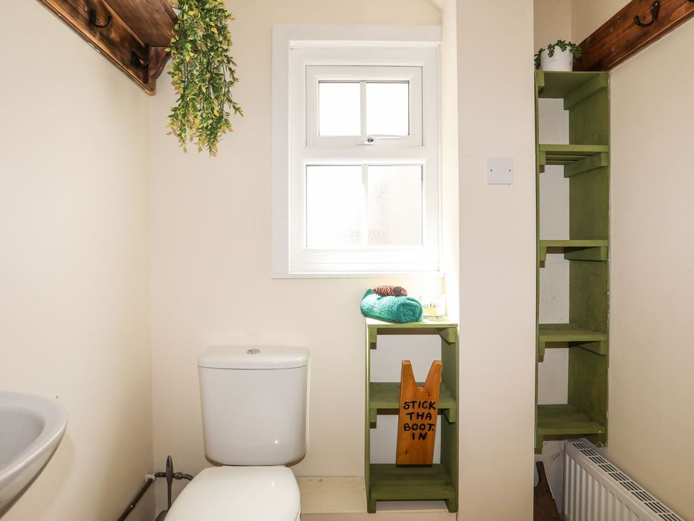 A bathroom with toilet and sink at Llys Elen in Caernarfon