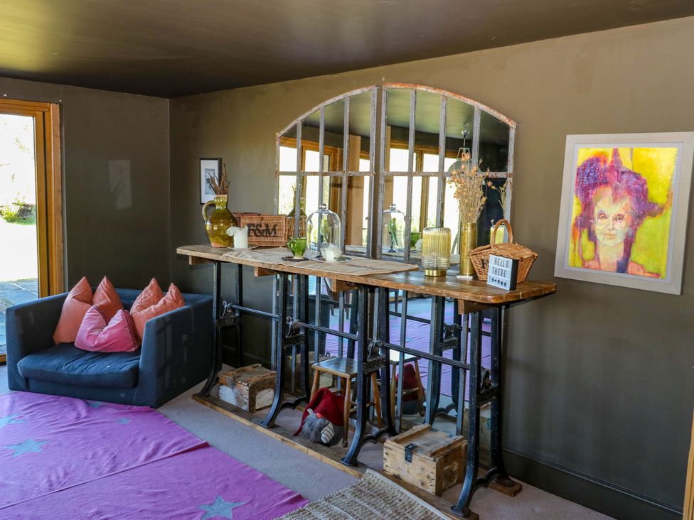 A living room with a sofa and table at Rocks Cottage in Halifax