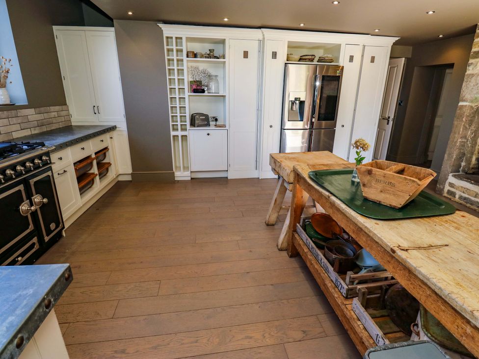 A kitchen with cabinets and stove at Rocks Cottage in Halifax