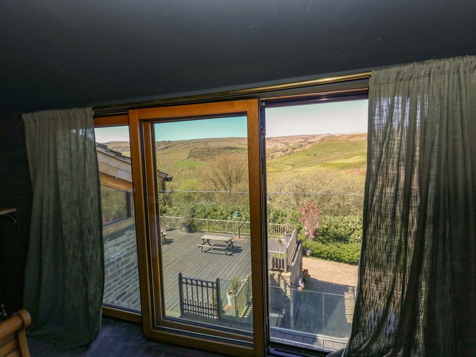 A view from a window showing a deck and outdoor landscape at Rocks Cottage Halifax