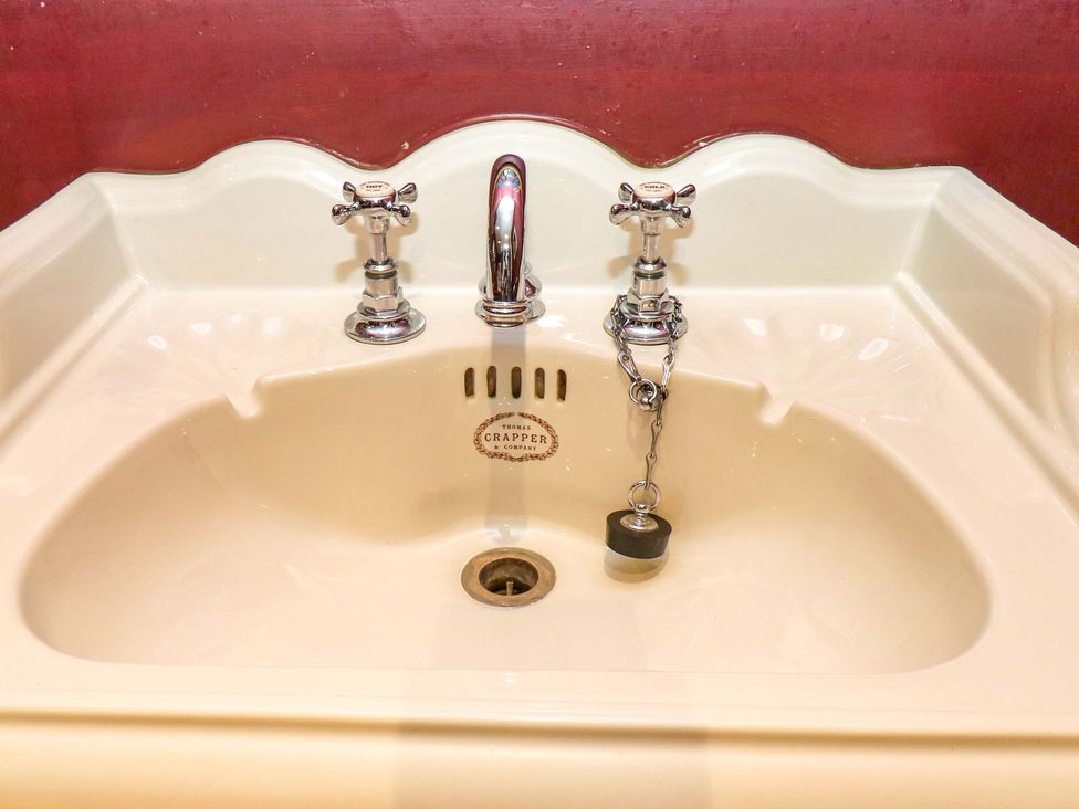 A sink with chrome faucets at Rocks Cottage in Halifax