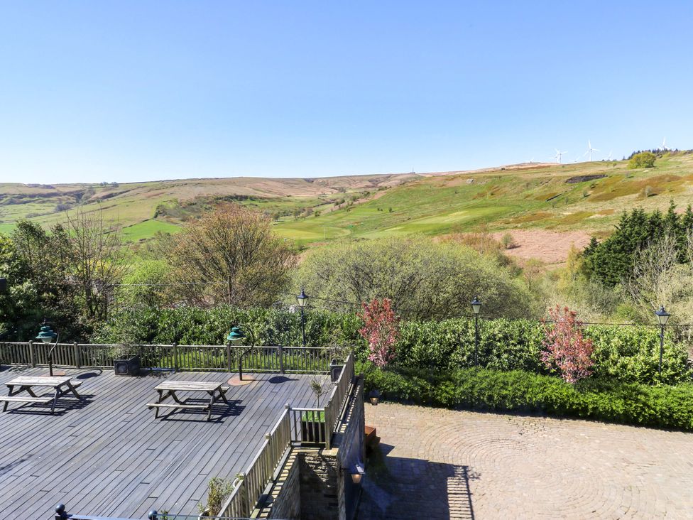 A deck area with benches and landscape view at Rocks Cottage in Halifax