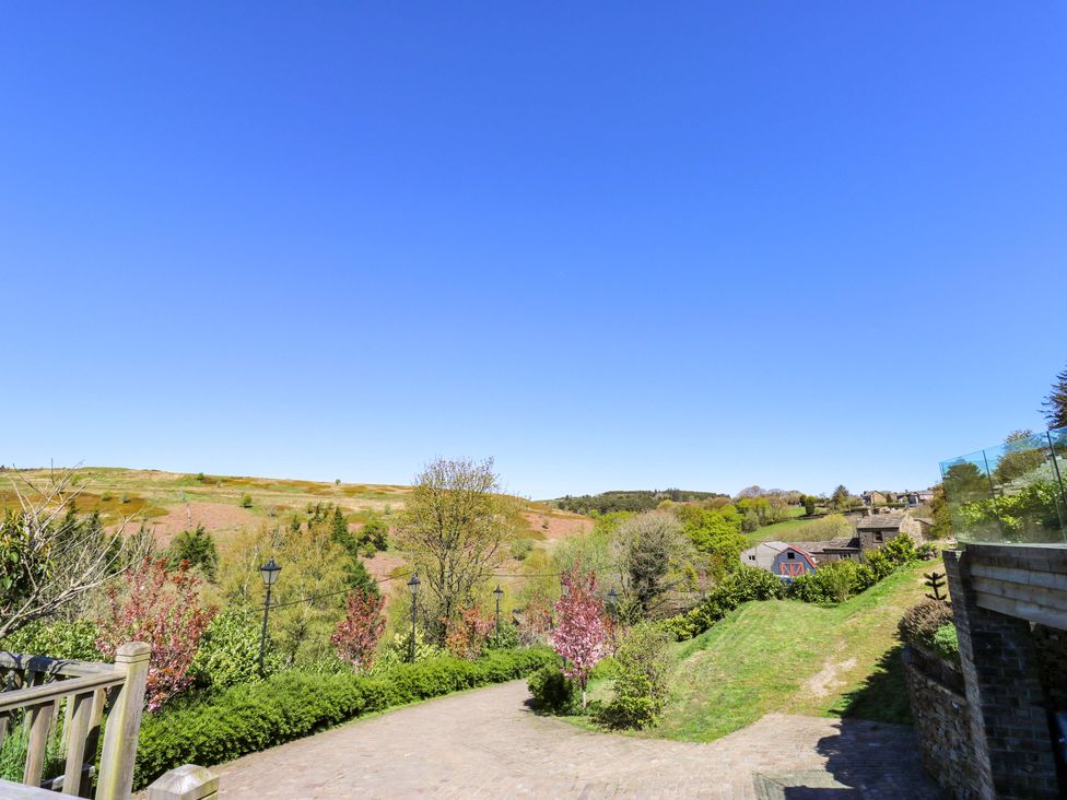 A landscape with trees and houses near a path at Rocks Cottage Halifax