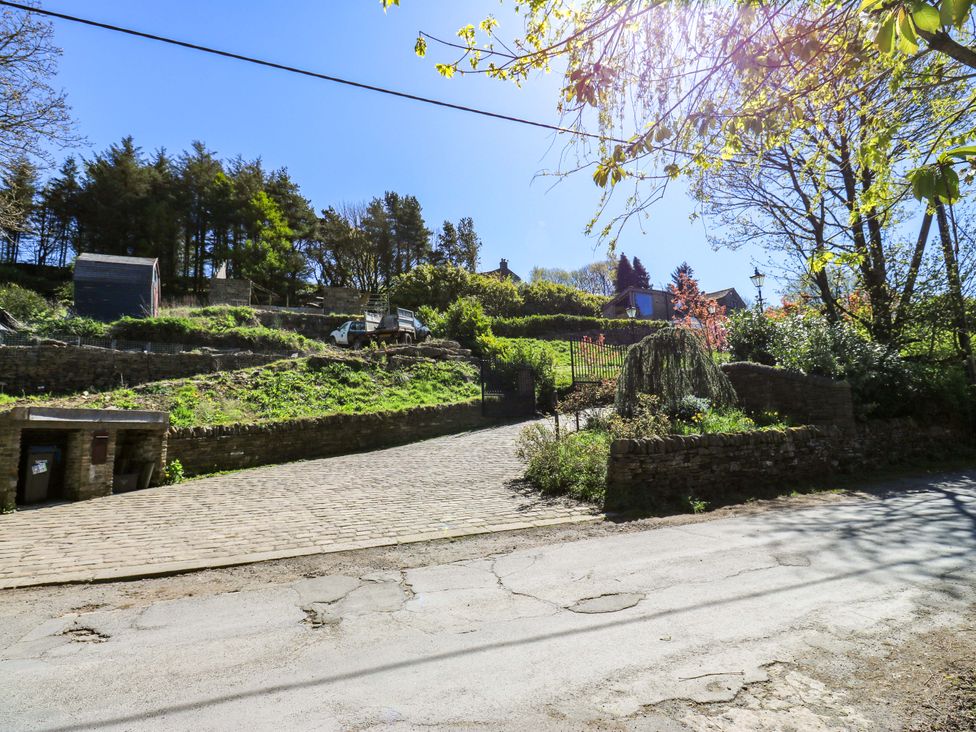 A cobblestone path leading to a gate at Rocks Cottage in Halifax