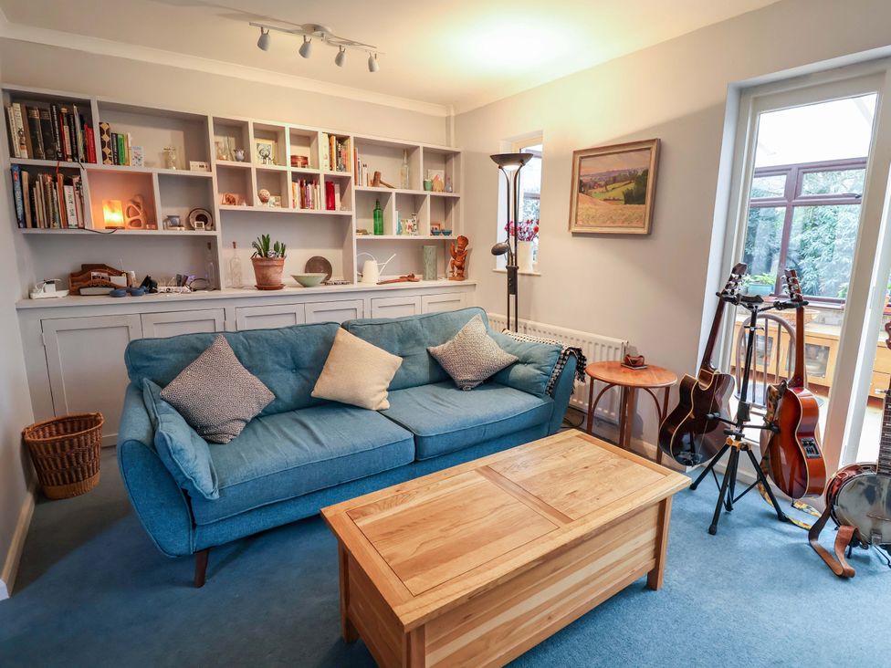 A living room with a sofa and coffee table at 17 Demesne Gardens in Ipswich
