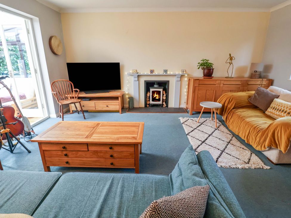 A living room with a sofa and coffee table at 17 Demesne Gardens in Ipswich