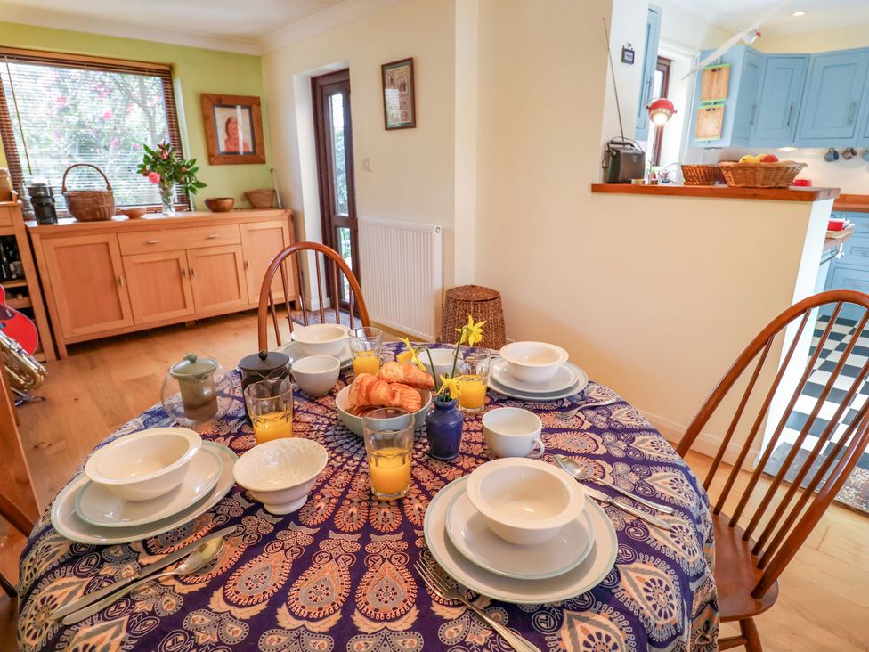 A dining room with a table set for breakfast at 17 Demesne Gardens Ipswich