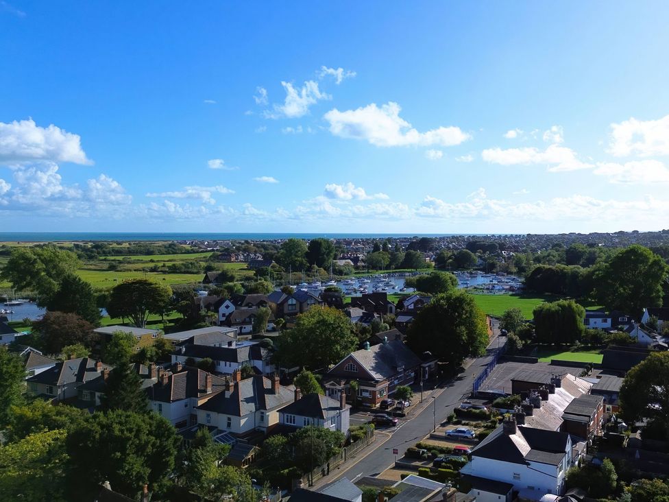 A view of houses and boats near water at Bosun's Deck in Christchurch