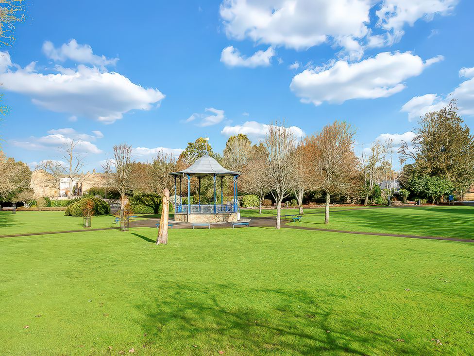 A park with a gazebo and trees at 40 Raleigh Court Sherborne