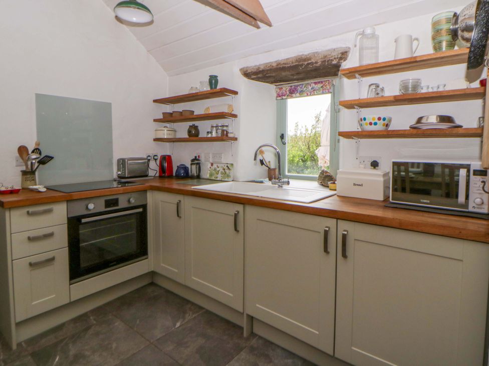 A kitchen with various appliances and utensils at Rhos Y Clegyrn Goodwick
