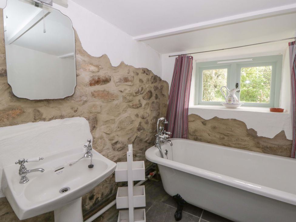 A bathroom with a sink and bathtub at Rhos Y Clegyrn in Goodwick