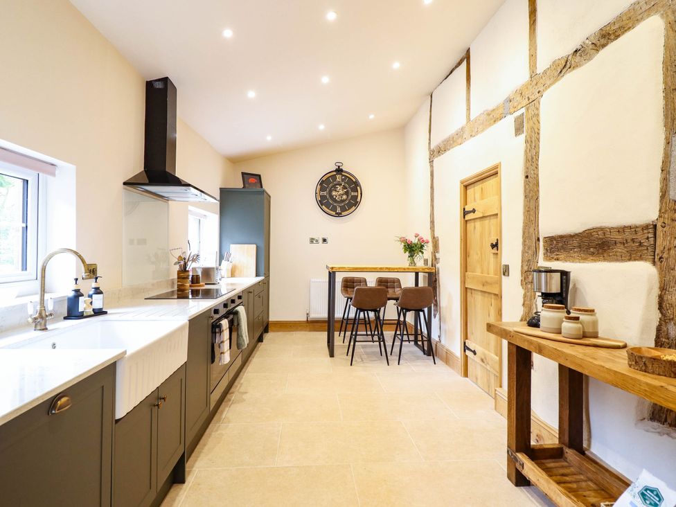 A kitchen with sink and cooker at Bridge Farm Pontyblew near Chirk