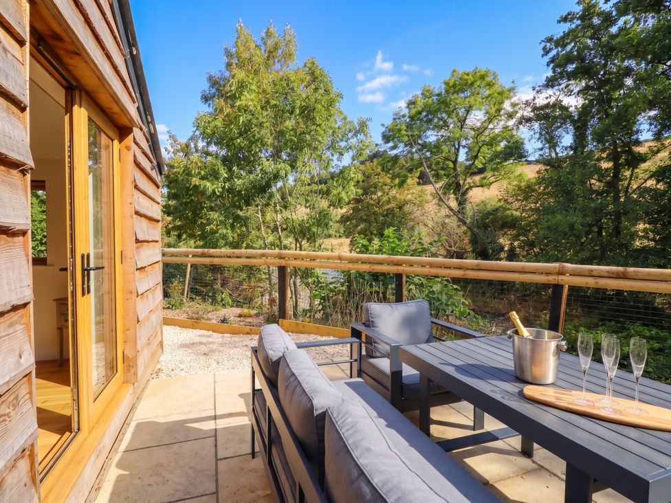 An outdoor area with seating and a view at Bridge Farm near Pontyblew Chirk