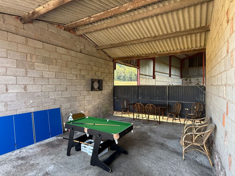 A games room with a pool table and dartboard at Bridge Farm Pontyblew near Chirk
