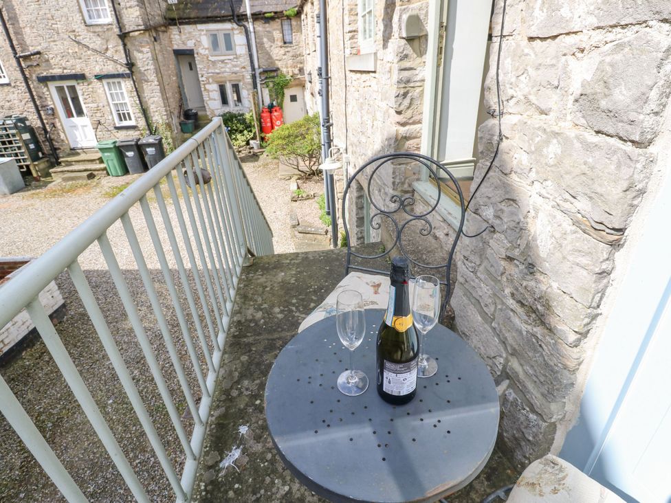 A table with champagne and glasses in an outdoor area at In & Out Cottage Leyburn