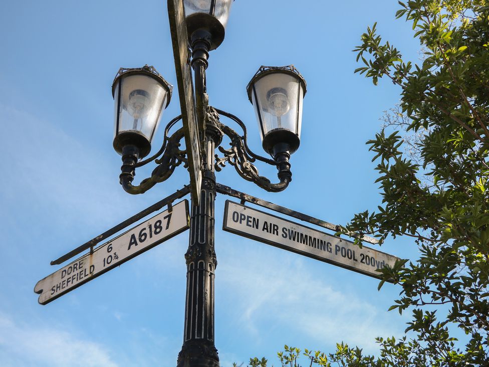 A street sign with directional information at Pine Cottage in 