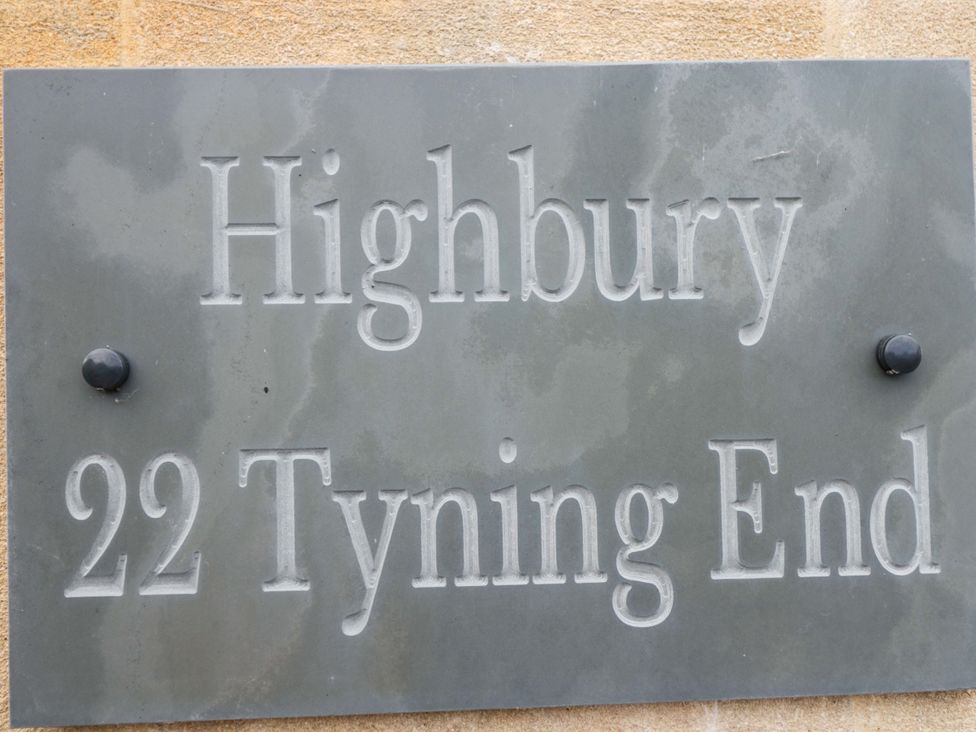 A nameplate displaying Highbury 22 Tyning End at Highbury in Bath