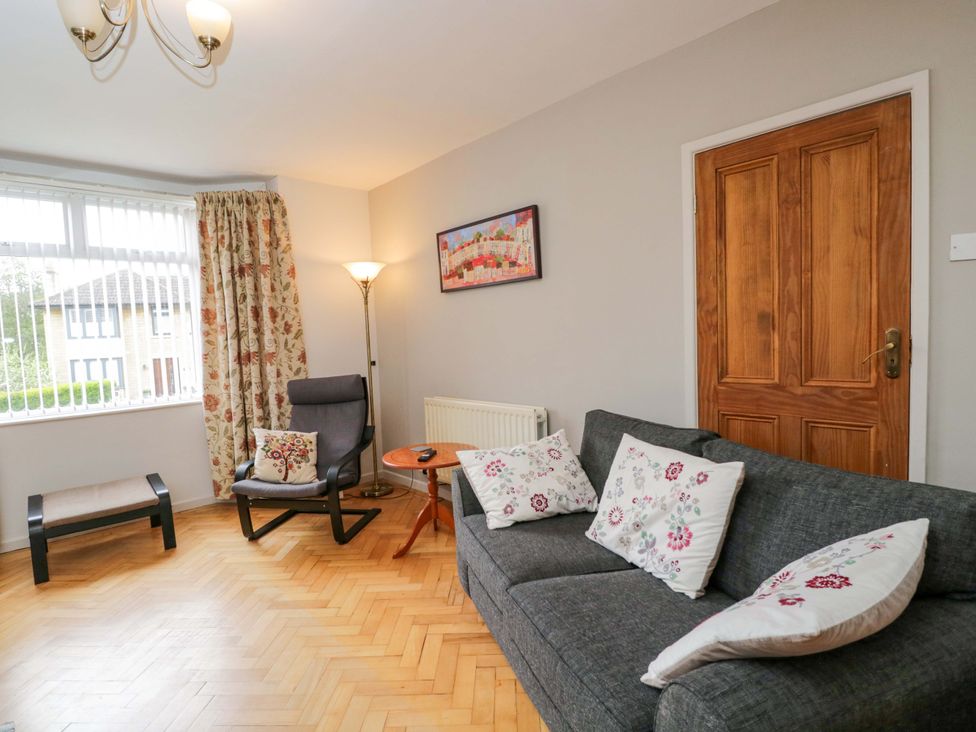 A living room with a sofa and armchair at Highbury in Bath