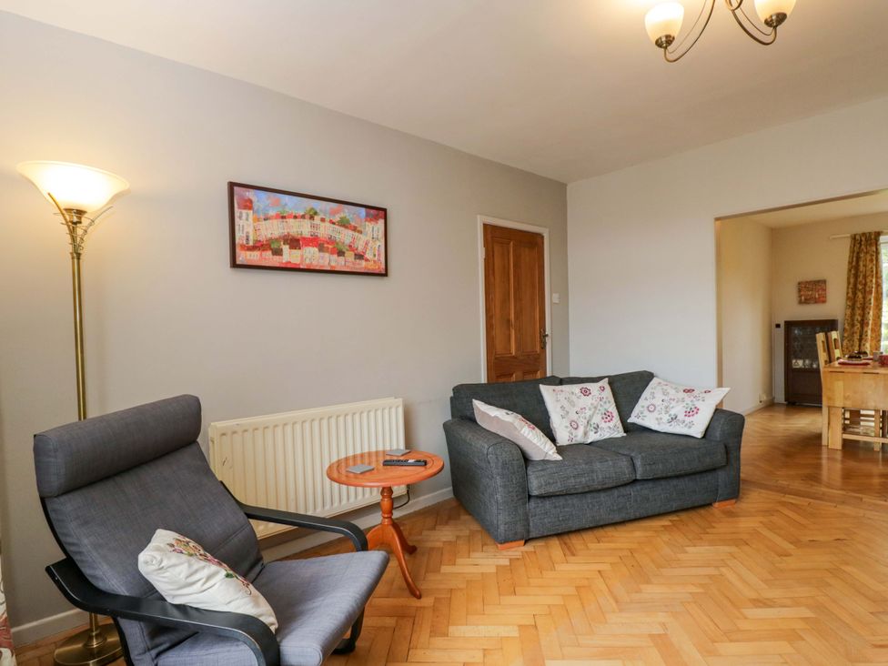 A living room with a sofa and armchair at Highbury in Bath